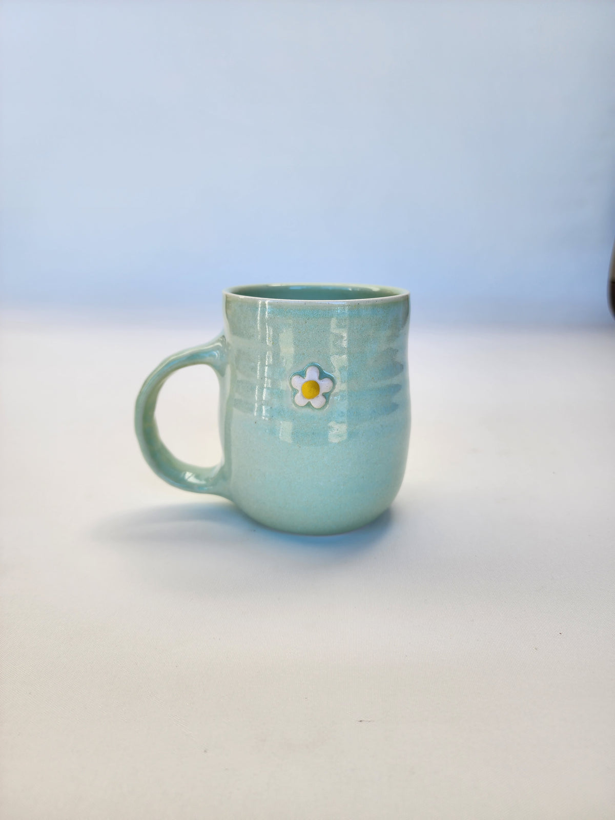 Mint green daisy mug