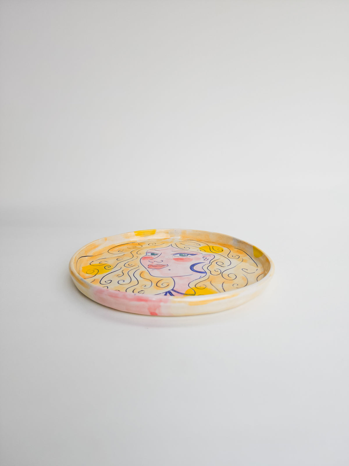 Small pottery face plate